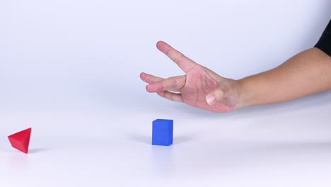 hand interacts with blue and red shapes