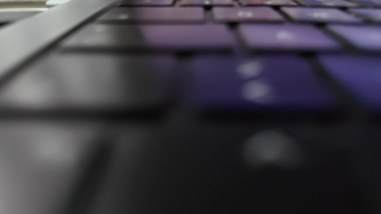 Laptop keyboard close-up, with blurred details