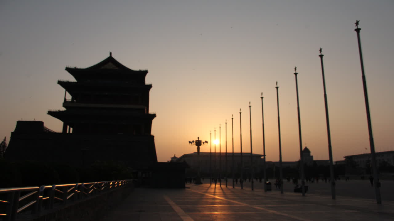 Sun setting over Tiananmen Square in Beijing.