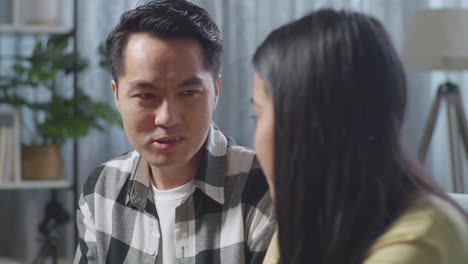 couple in conversation at home