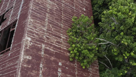 birdseye view as mother nature starts to reclaim a long-abandoned factory in los canos puerto rico