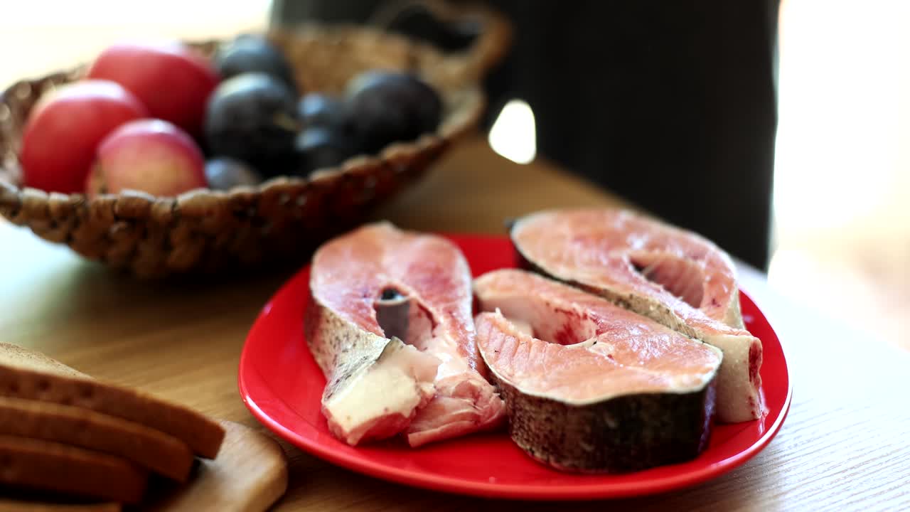 Fish steaks and fruit in a basket
