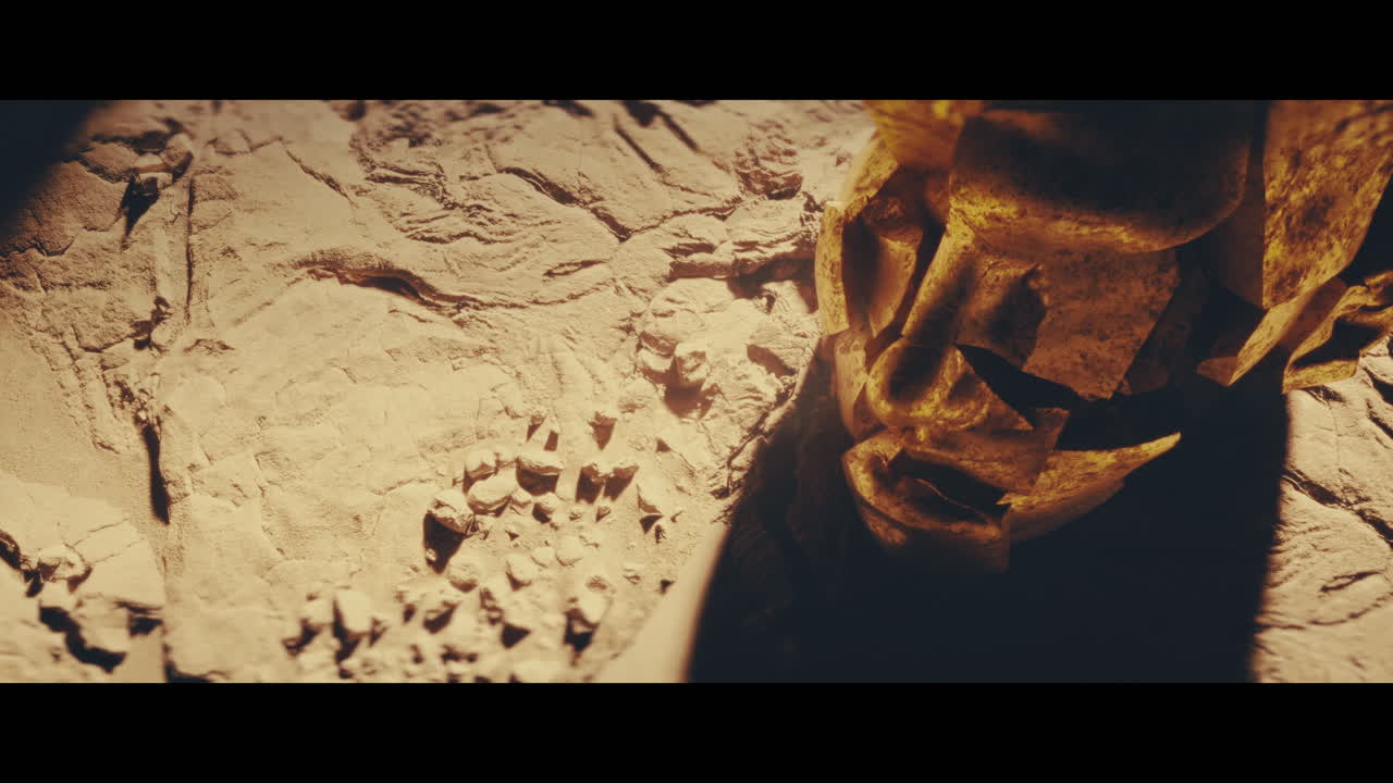 Huge golden statues in the desert during sunset