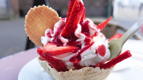 eating strawberry ice cream outdoors