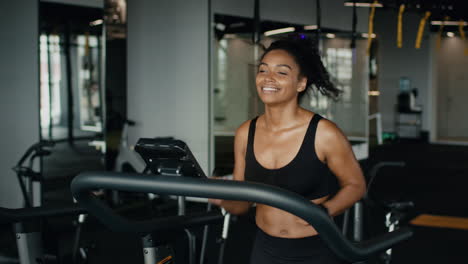 woman exercising on treadmill in gym