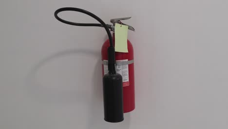 fire extinguisher on the wall as a fire prevention measure in a building in bangkok, thailand