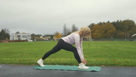 woman practicing low lunge  yoga pose outdoor