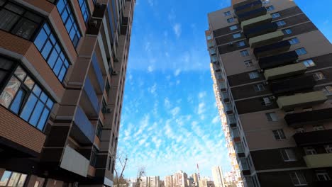 clouds float among the houses