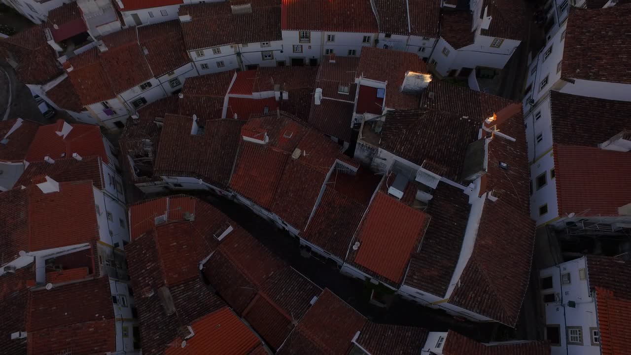 Aerial View of a Charming European Town with Red Tile Roofs
