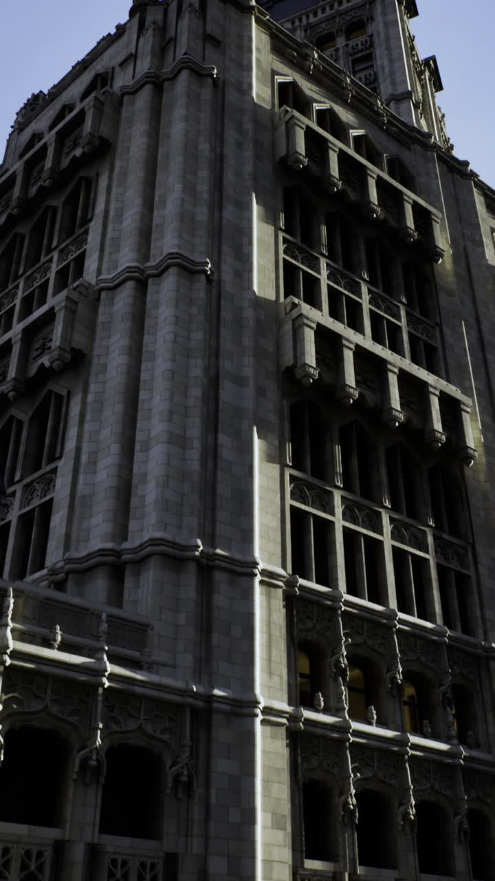 Historic building in urban area under clear sky during late afternoon light
