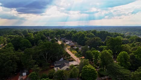 breath-taking view of rays of sun hitting houses in greenville, sc. hope for the housing market.