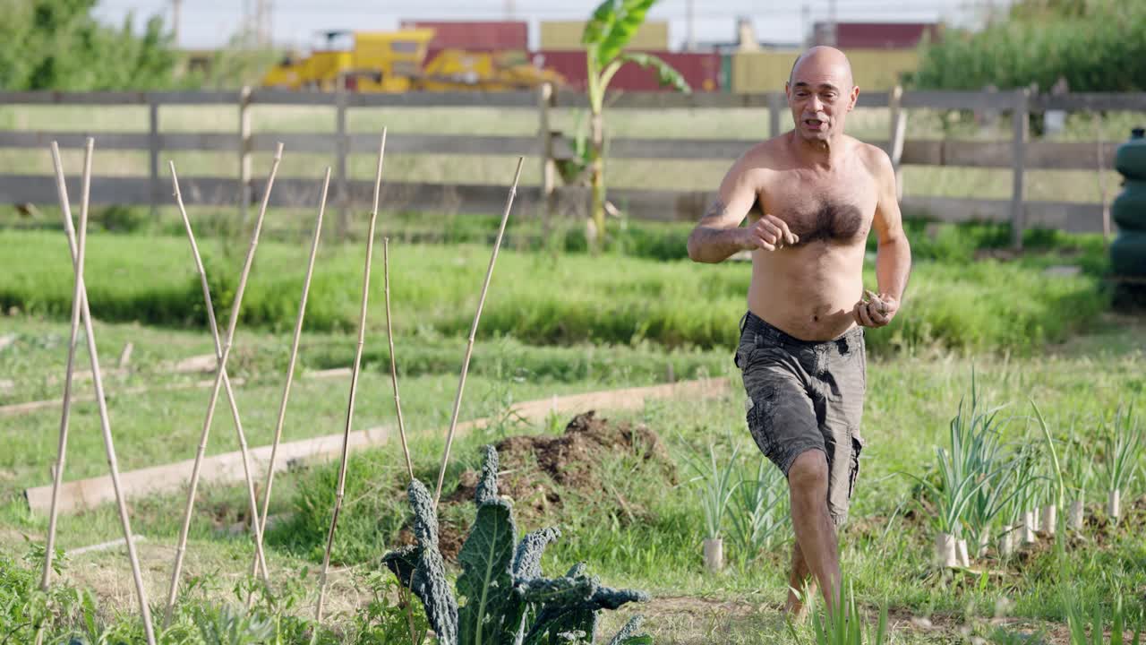 Barefoot farmer working hard in his vegetable garden