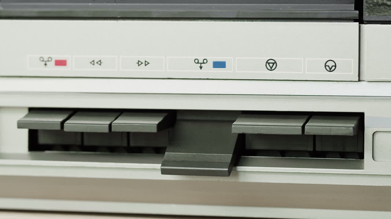 Close-up of a vintage cassette tape player control panel