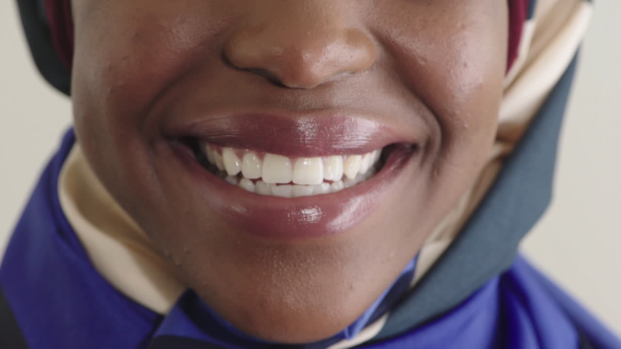 close up woman mouth smiling healthy white teeth african american woman perfect dental hygiene wearing headscarf