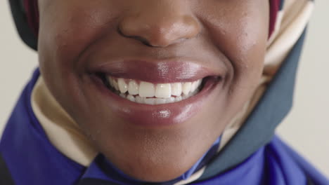 close up woman mouth smiling healthy white teeth african american woman perfect dental hygiene wearing headscarf