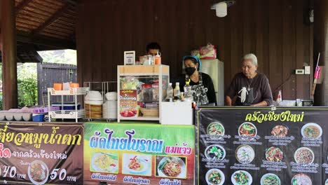 vendor preparing and selling street food