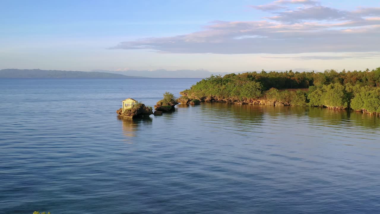 Calm water during sunset. Beautiful sunset. Mountains background. Philippines, Asia