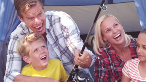 happy family with a fishing rod