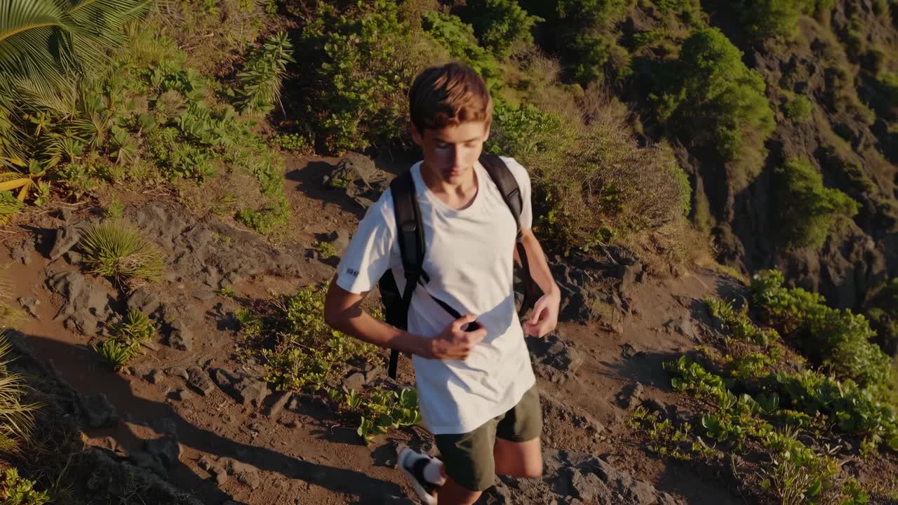 Teenager Hiking on Mountain Trail