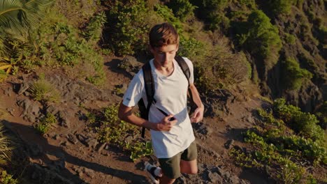 teenager hiking on mountain trail