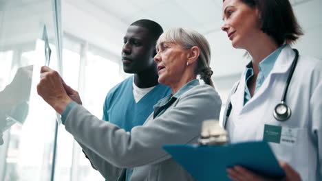 medical professionals examining x-ray