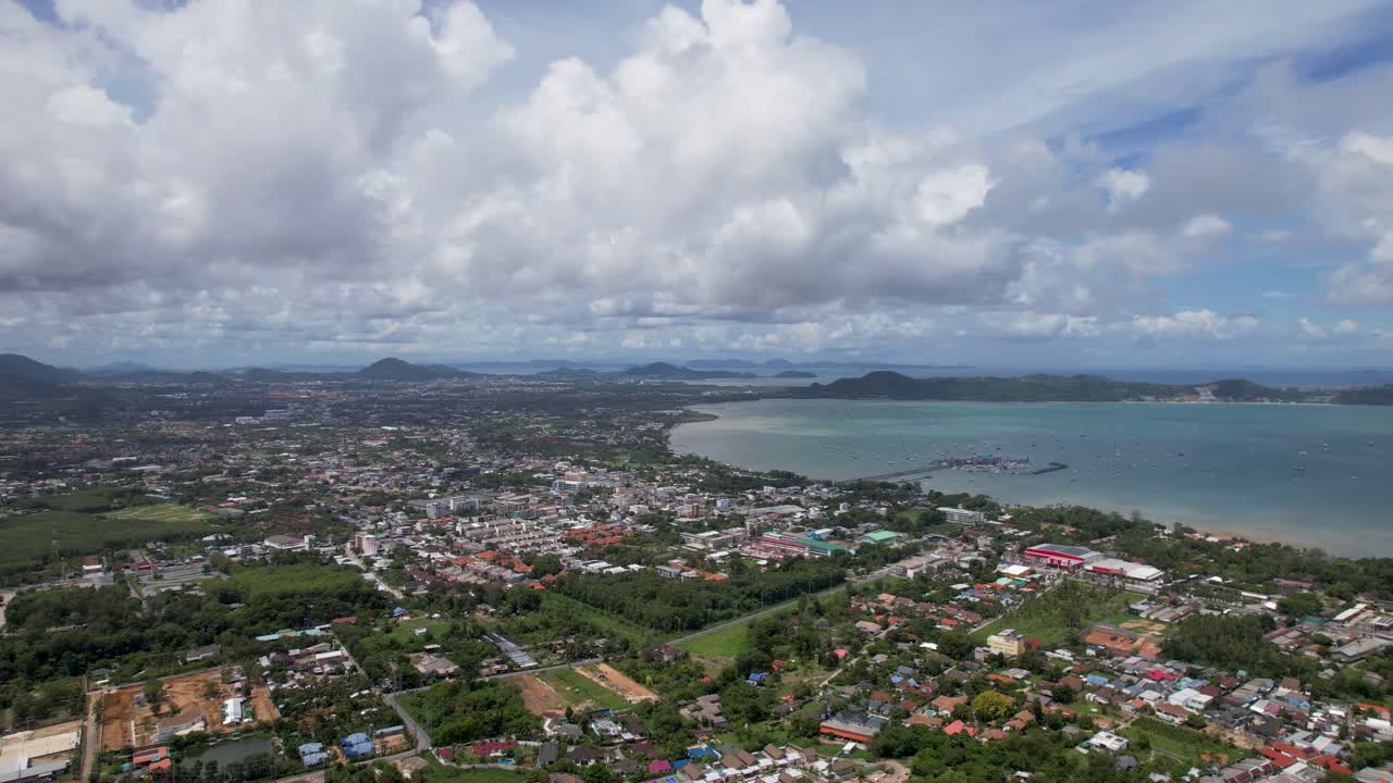 Phuket, aerial drone shot over a Rawai Mueang district on a beautiful sunny day, a turquoise lagoon facing Phi Phi island in a famous Thailand tourist location