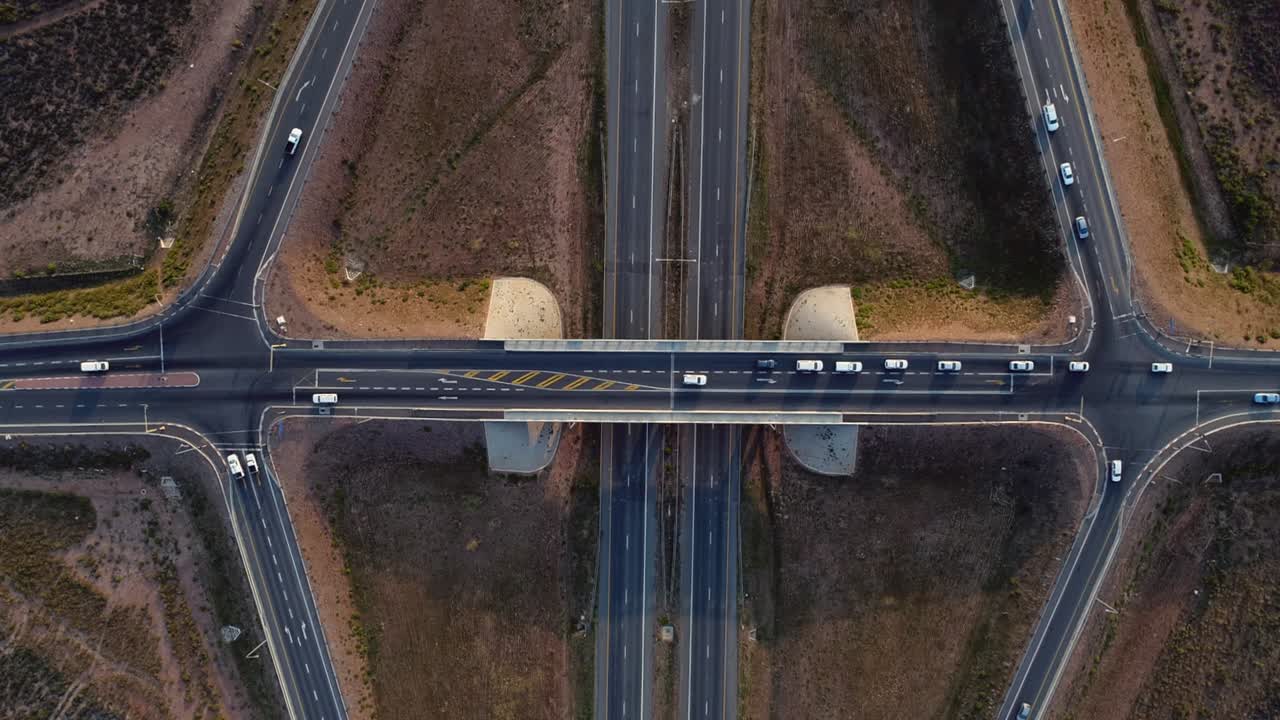 Fast speed vehicles driving on highway overpass, overhead view