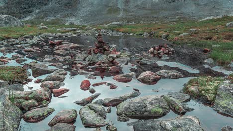 peculiar stone cairn amidst the shallow mountain stream