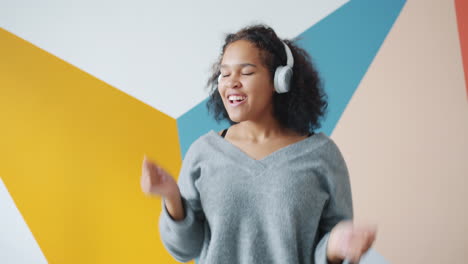 teenage girl dancing to music