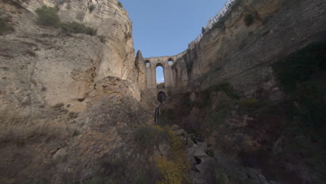 FPV-drone-flight-up-Guadalevin-River-gorge-toward-Ronda-new-bridge