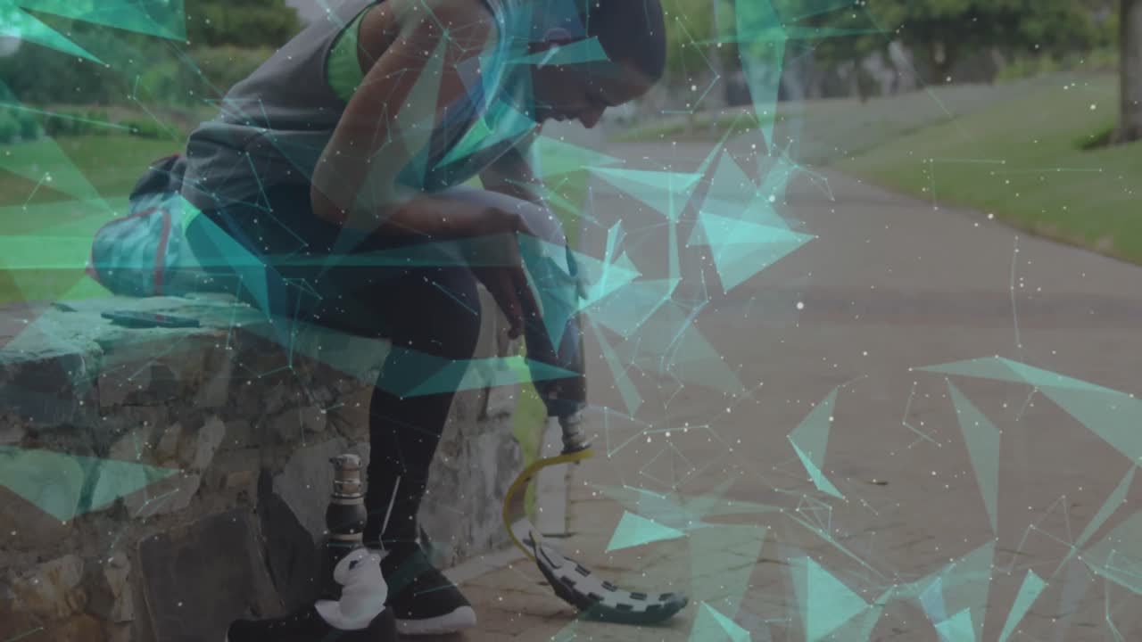 Animation of floating network over male athlete preparing running blade for exercise outdoors