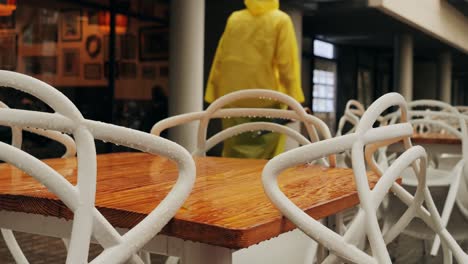 wet table and chairs on a rainy day
