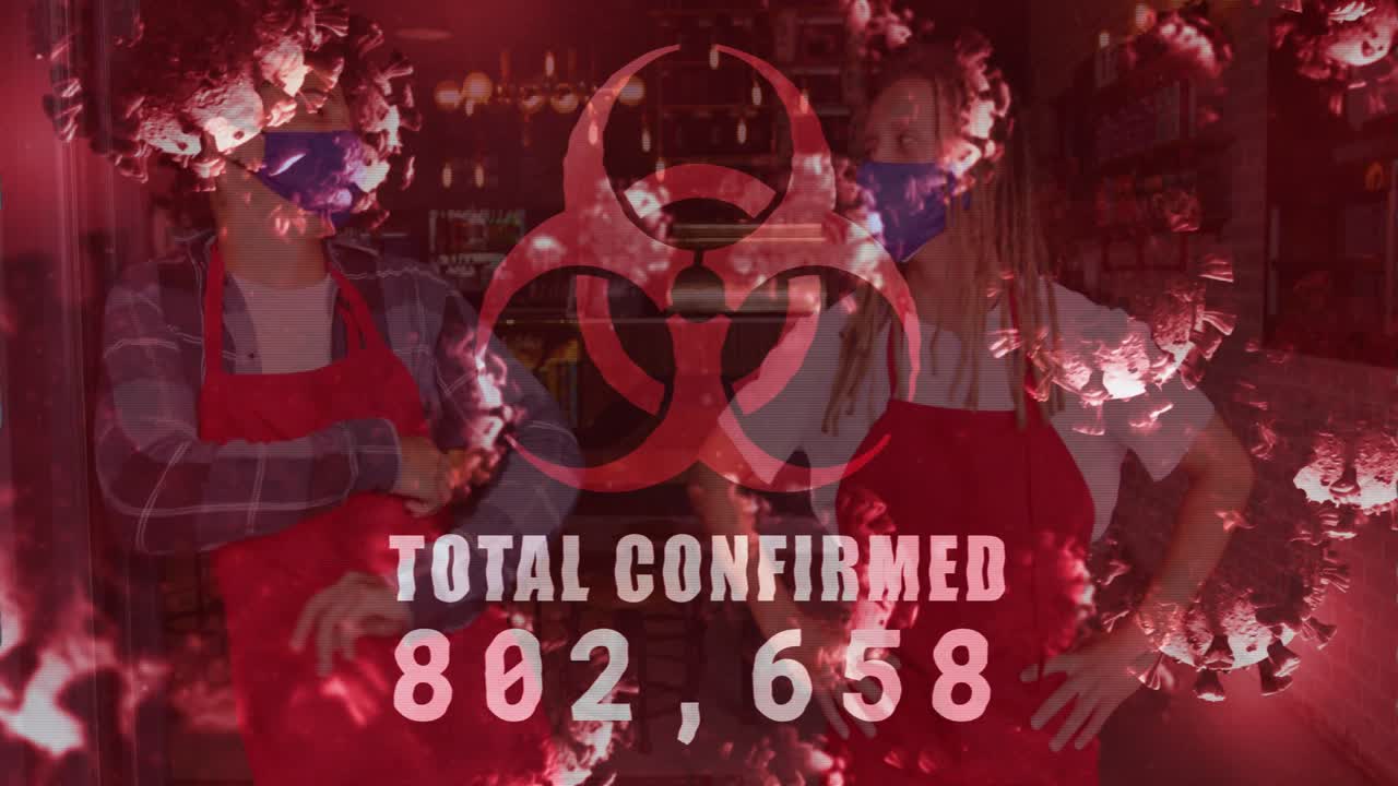 2 staff glancing in shop as data updating, biohazard overlay incrementing TOTAL CONFIRMED counter