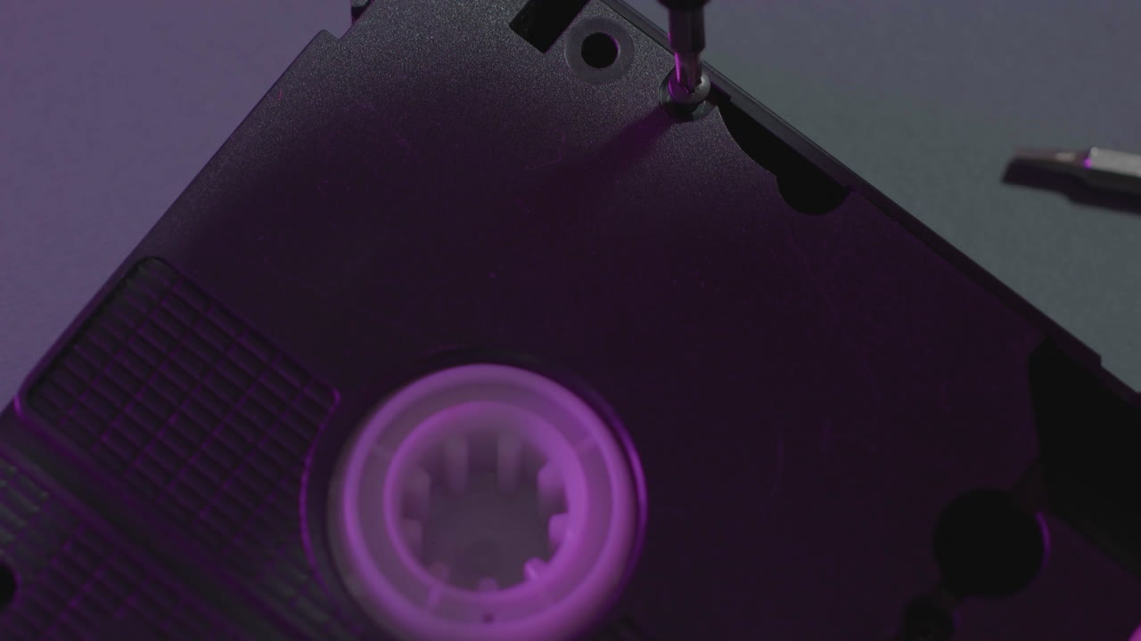 VHS cassette on purple background
