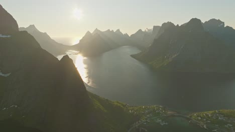 Glowing-midnight-sun-over-Lofoten-in-Norway,-aerial-drone-view