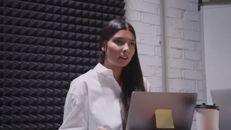 young woman having a team meeting in the boardroom