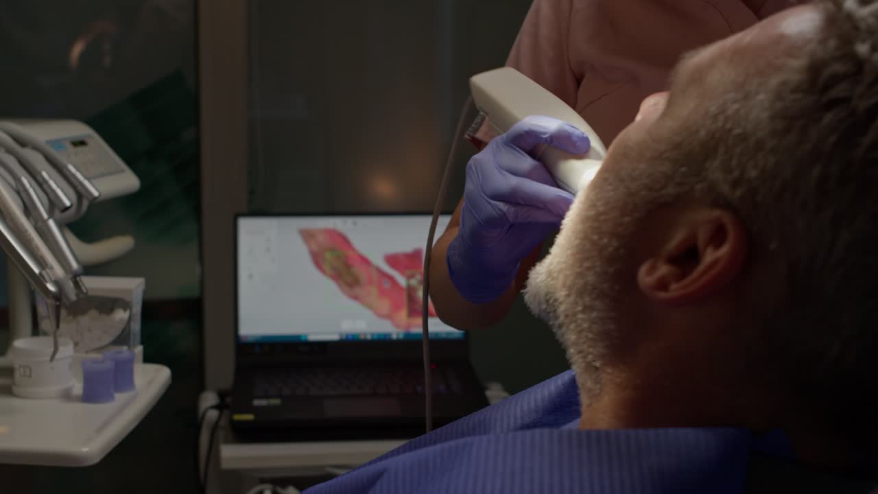 Dentist Using 3D Dental Intraoral Scanner For Scanning Patient's. Teeth for Healthcare Concept