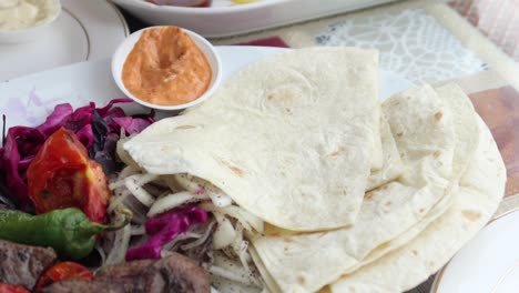 delicious turkish kebab with pita bread and vegetables