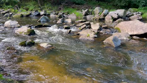 stream Water and Green Mossy Rocks River Flow in the Mountains Stream Water and Green Mossy Rocks Water Rushes through the Rapids River Flow in the Mountains