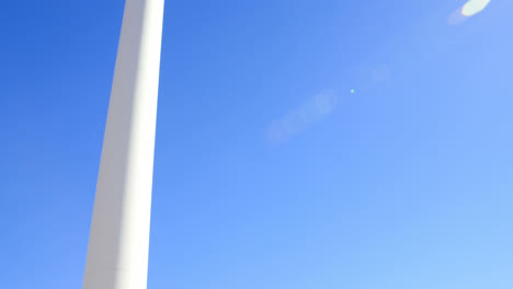 Male-engineer-taking-photo-of-wind-turbine-with-mobile-phone-4k