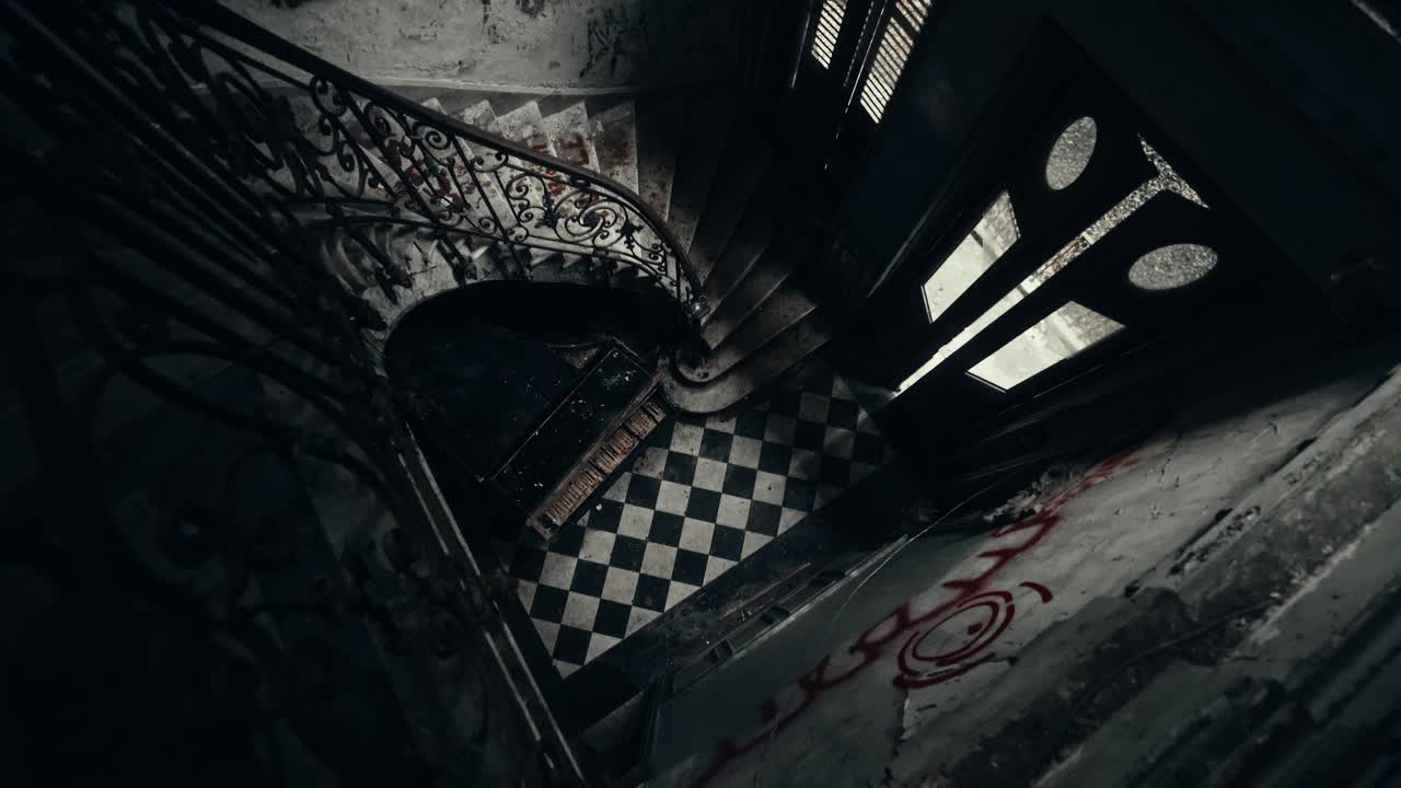 High Angle View of Dark Abandoned Spiral Staircase with Checkered Floor