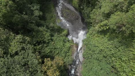 bird's eye straight down view: tiu kelep waterfall in lombok indonesia