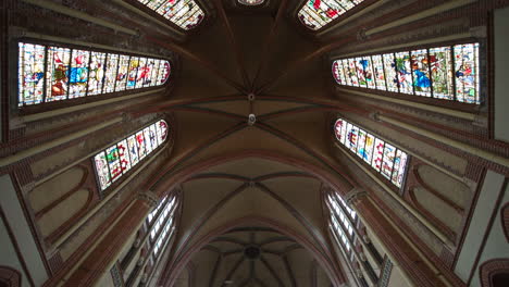 stained glass panels at the rib vault ceiling of gouwekerk church in the dutch city of gouda