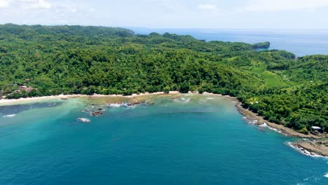 azure ocean lagoon tropical forest at paradise wediombo beach, indonesia, aerial view