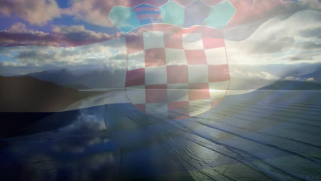 digital composition of waving croatia flag against aerial view of beach and sea waves