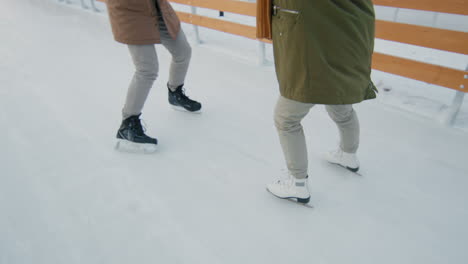 couple ice skating on a winter day