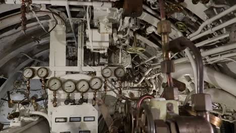 elements inside an old submarine's command control room, sliding shot