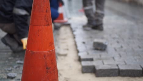 construction workers paving a street