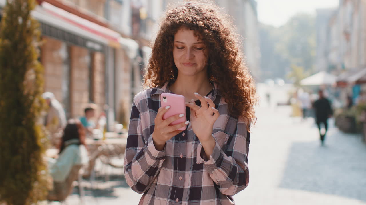 Tourist traveler woman girl using looking smartphone search a way on map in mobile navigator app