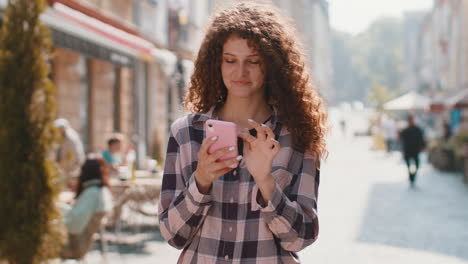 tourist traveler woman girl using looking smartphone search a way on map in mobile navigator app